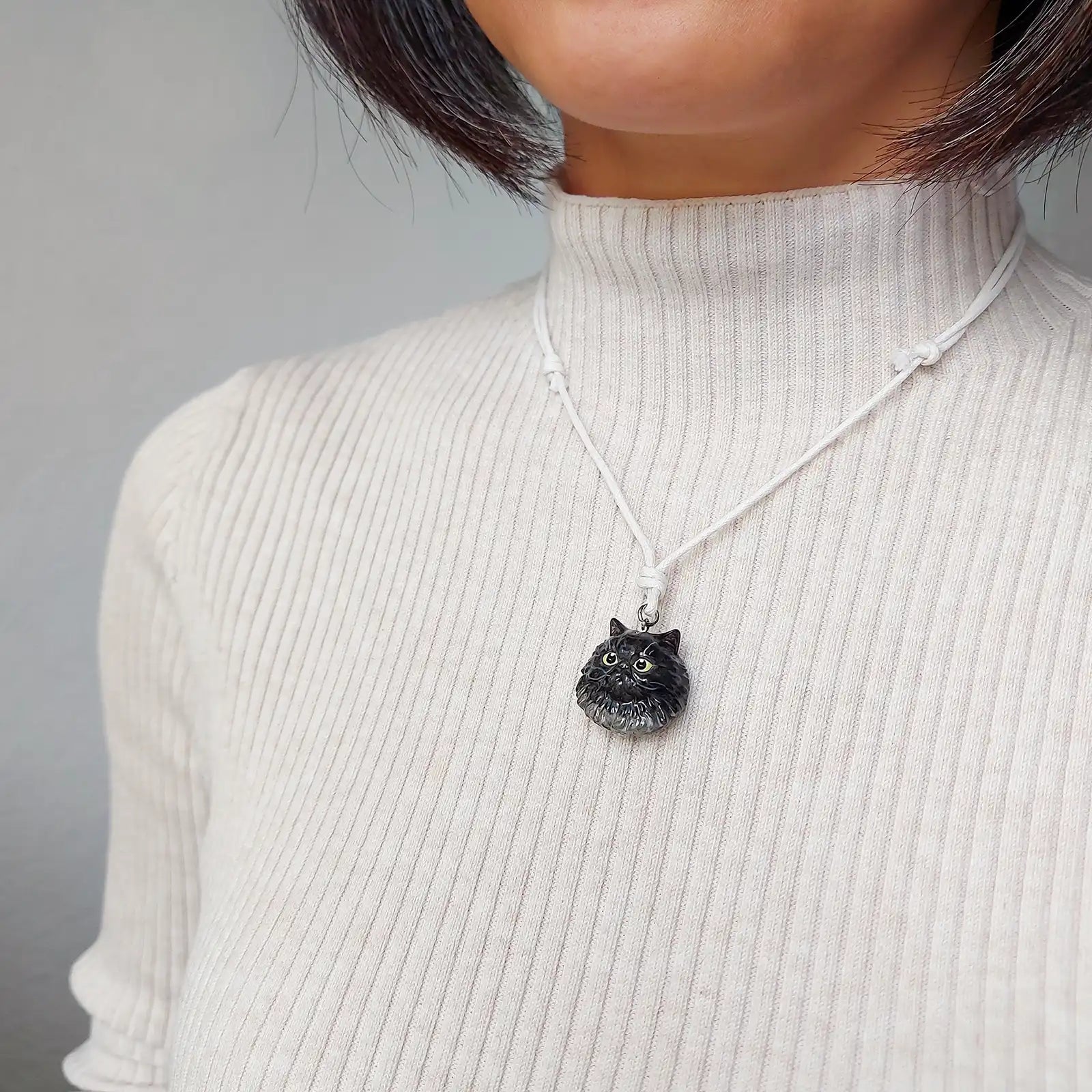 cat persian black pendant wearing