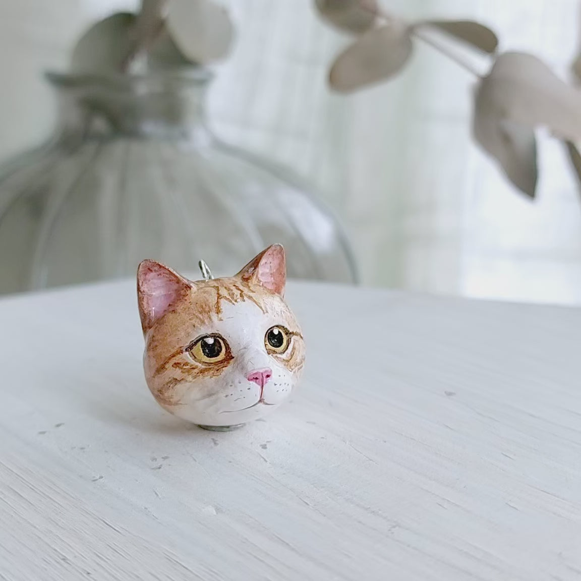 cat domestic shorthair ginger white pendant turn table
